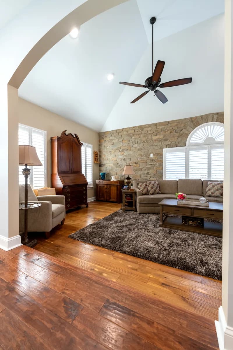 After — the suite living room — stone wall, refinished floors