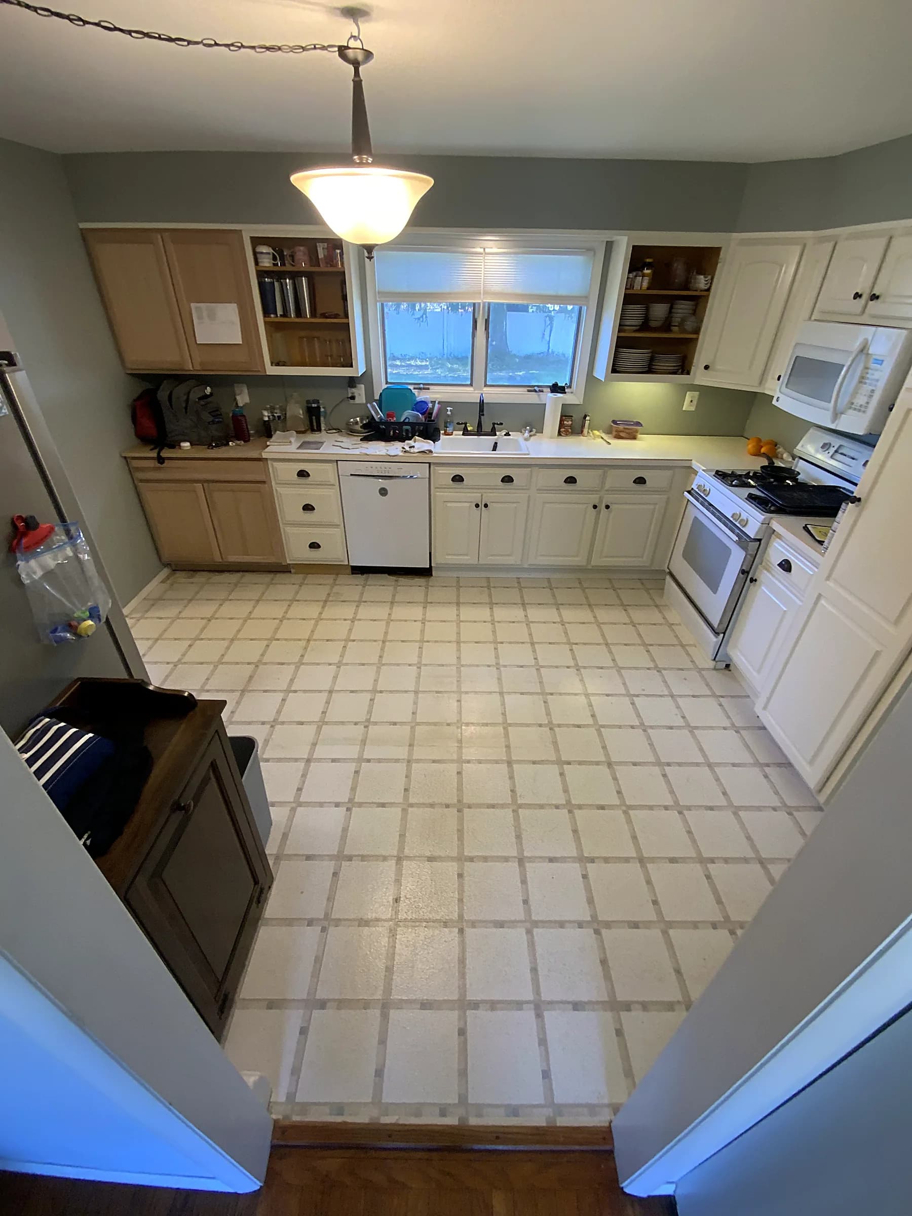 Dated kitchen, brightened to warm white — before