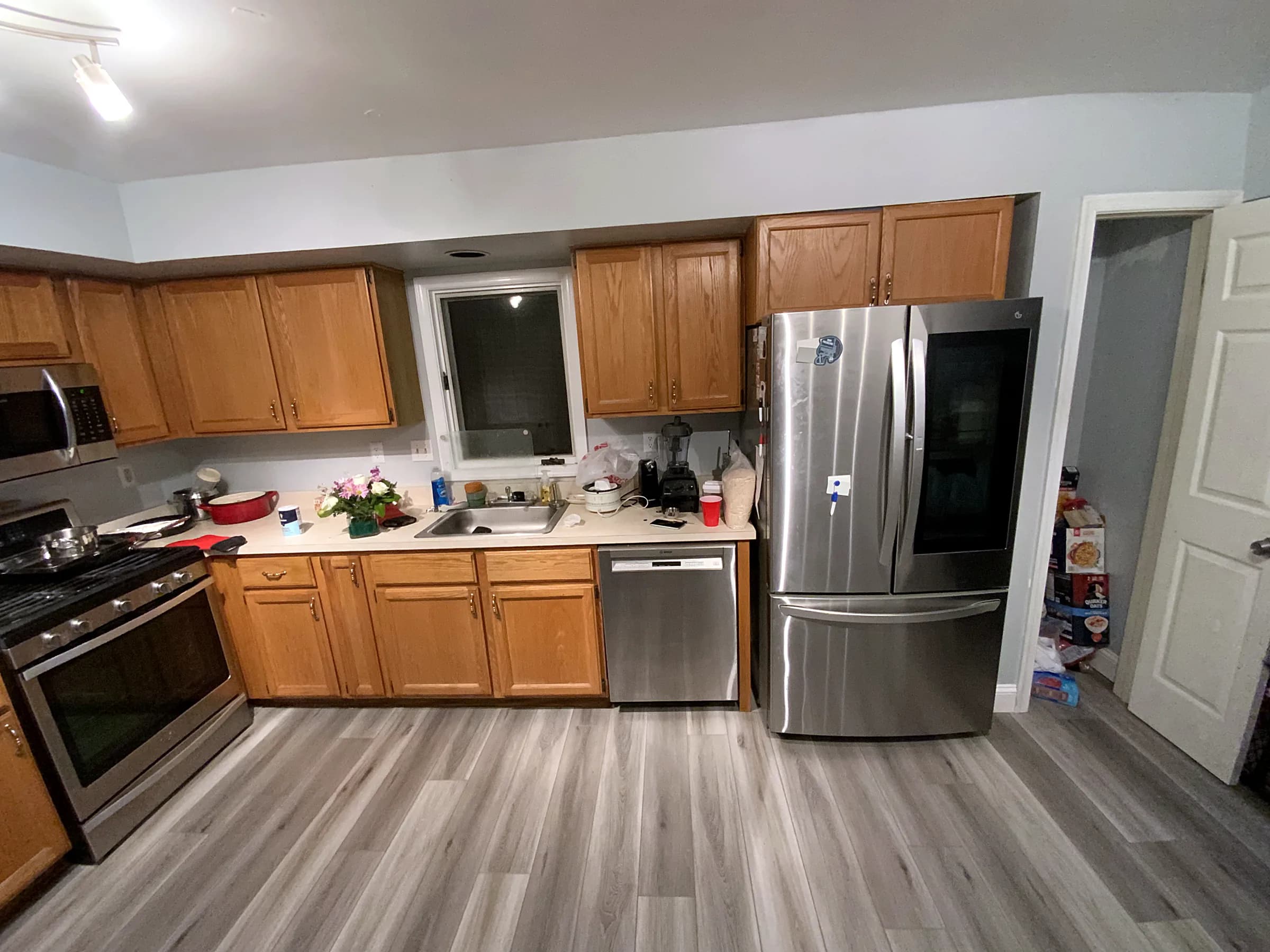 Tired oak kitchen to bright shaker remodel — before